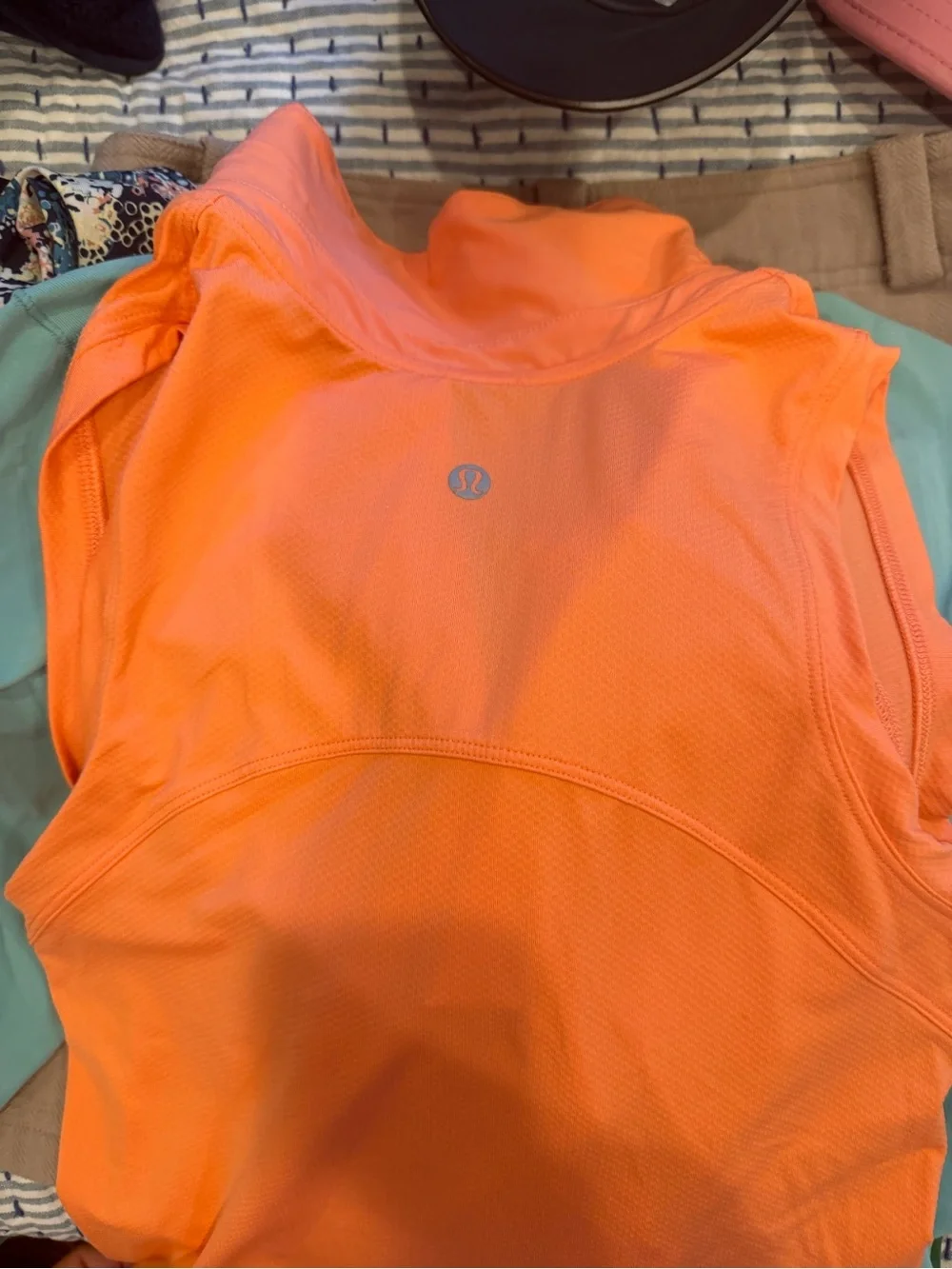Lululemon gold or tennis polo Orange Sleeveless Golf Polo with White Logo